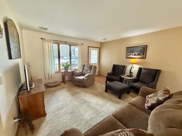 carpeted living area with visible vents