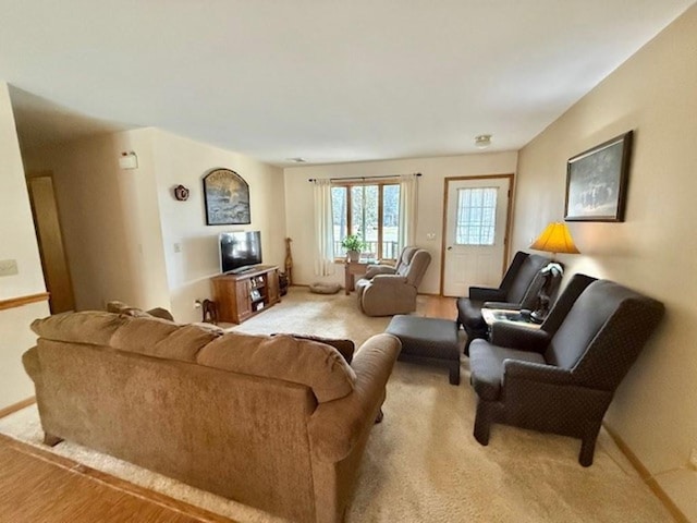 living room with light colored carpet and baseboards