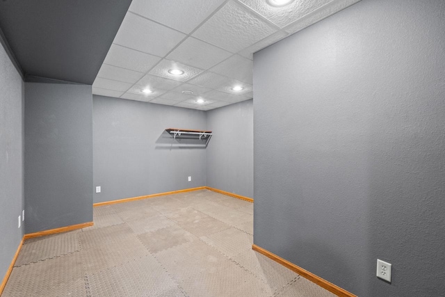 carpeted spare room with recessed lighting, a paneled ceiling, and baseboards