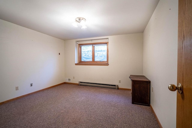 spare room featuring a baseboard heating unit, carpet flooring, baseboards, and visible vents