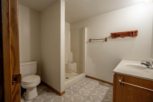 full bath with a shower stall, toilet, baseboards, and tile patterned floors