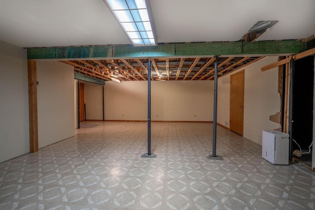 finished basement with tile patterned floors