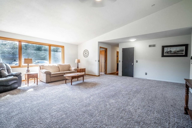 carpeted living area with visible vents, baseboards, and vaulted ceiling