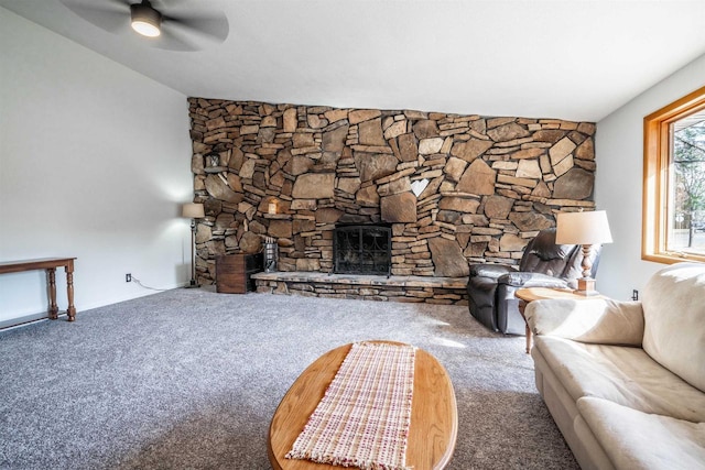 unfurnished living room with a fireplace, carpet, and ceiling fan