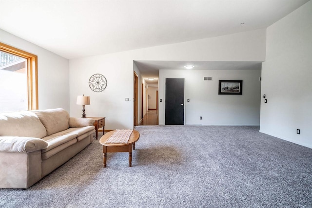 carpeted living room with visible vents and baseboards