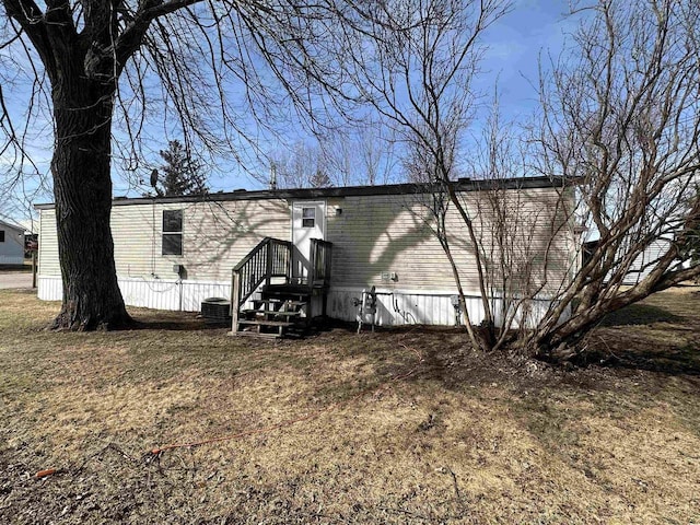 back of property with central air condition unit