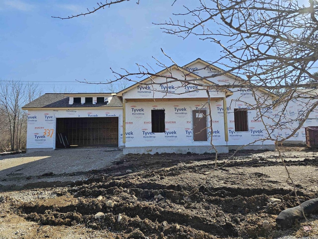 property in mid-construction featuring an attached garage