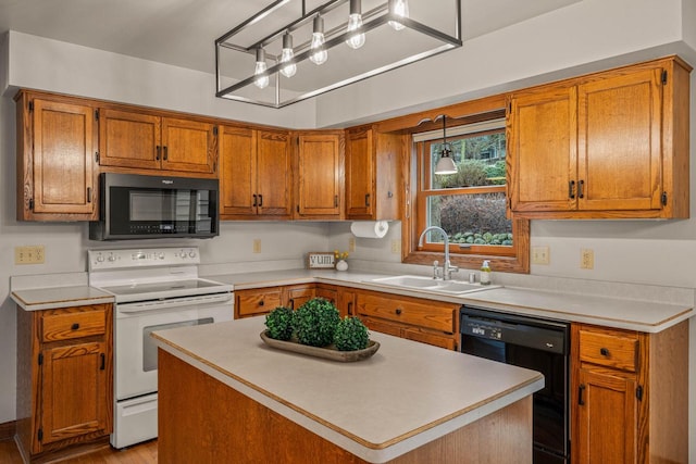 kitchen with a sink, black appliances, light countertops, decorative light fixtures, and brown cabinets