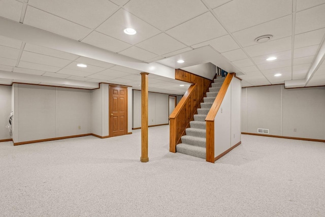 finished basement featuring visible vents, recessed lighting, stairs, and carpet