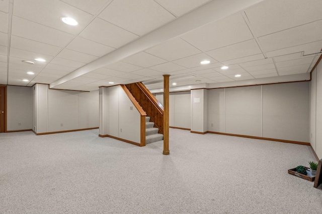 finished basement with recessed lighting, stairway, a paneled ceiling, and carpet flooring