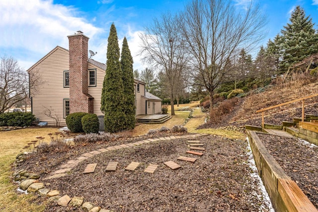 view of side of property featuring a chimney