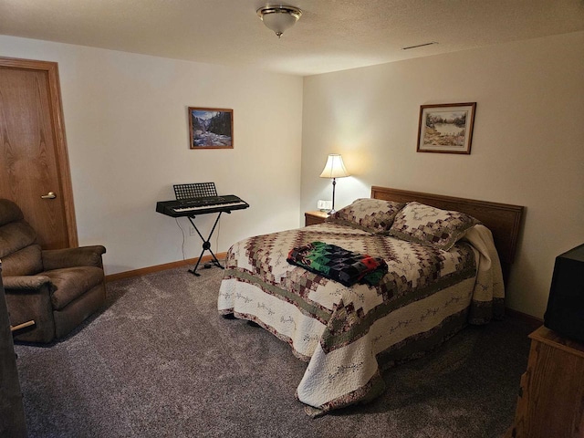 carpeted bedroom featuring baseboards