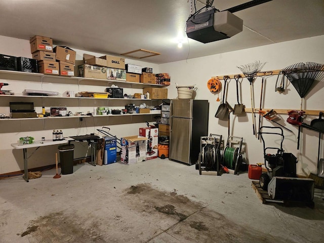 garage with a garage door opener and freestanding refrigerator