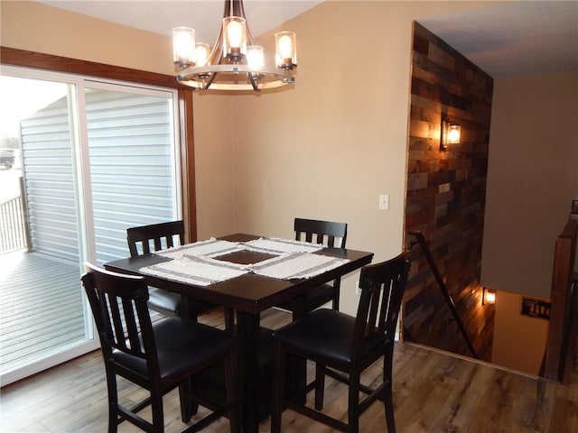 dining room featuring an inviting chandelier and wood finished floors