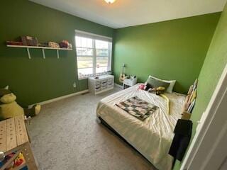 bedroom featuring baseboards and carpet flooring