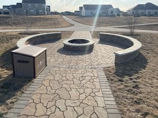 exterior space featuring a patio and an outdoor fire pit