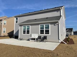 back of property featuring a patio area