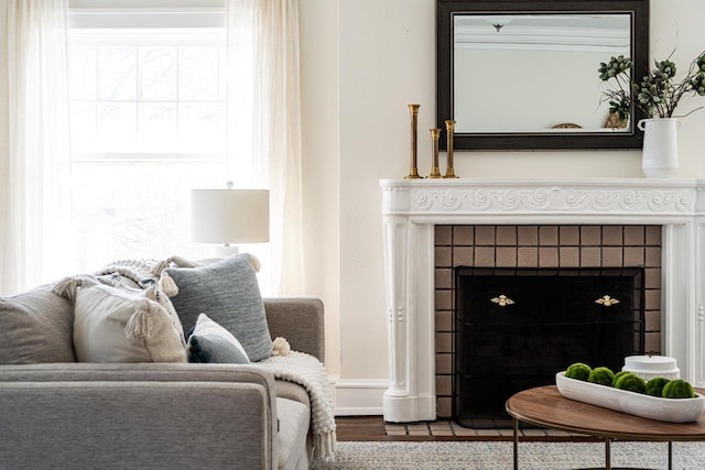 living room with a tiled fireplace