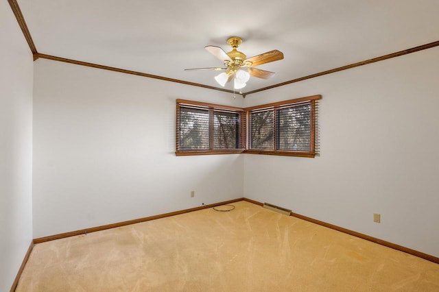 unfurnished room featuring light carpet, baseboards, and ornamental molding