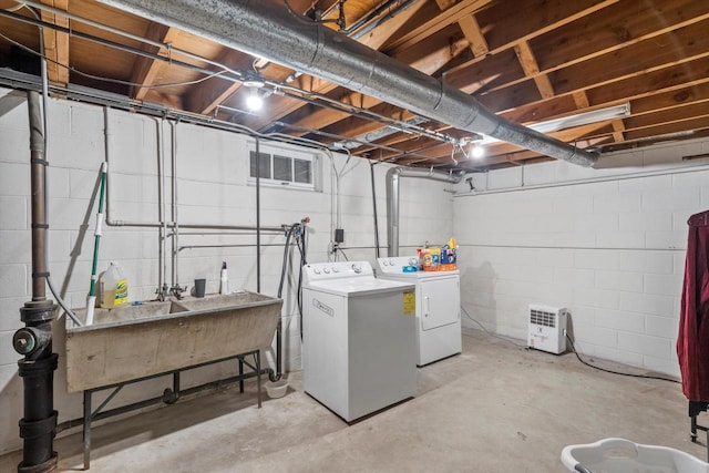 clothes washing area with laundry area, visible vents, and washer and clothes dryer