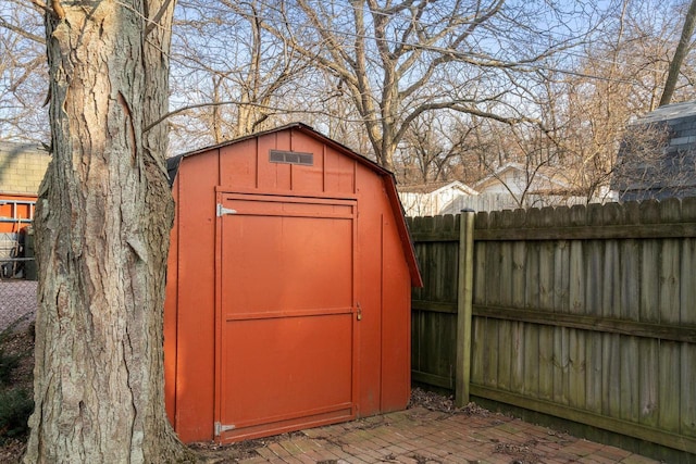 view of shed with a fenced backyard