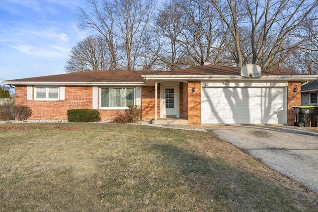 single story home featuring a front lawn, a garage, brick siding, and driveway