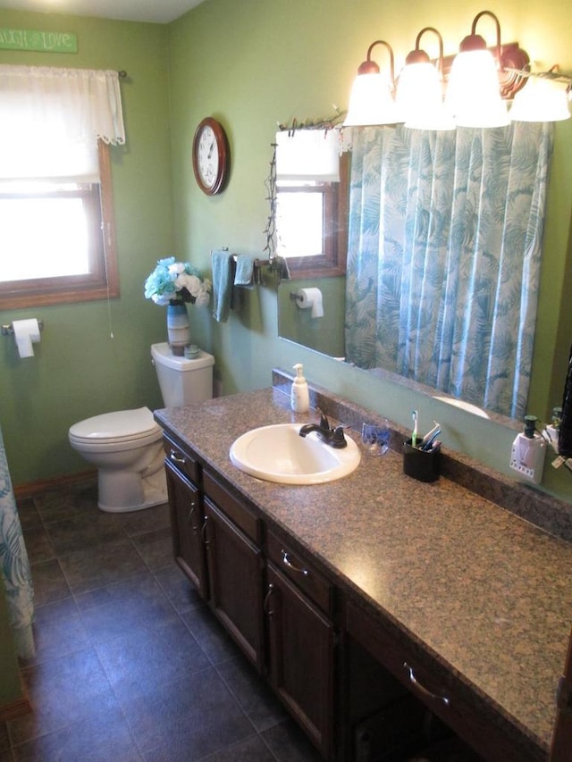 full bath with toilet and vanity