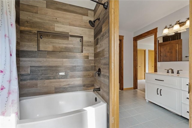 bathroom featuring tile patterned flooring, vanity, and shower / bathtub combination with curtain