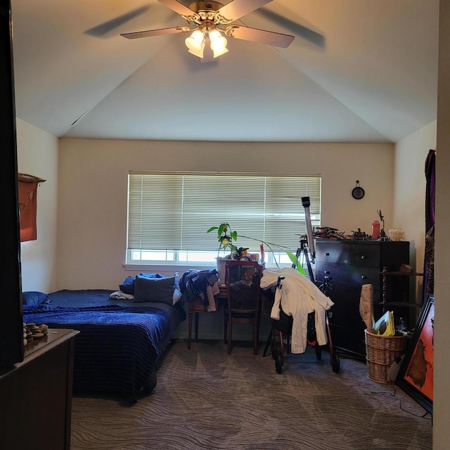 carpeted bedroom featuring vaulted ceiling and a ceiling fan