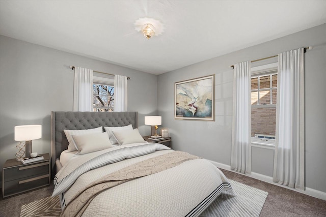 carpeted bedroom featuring baseboards