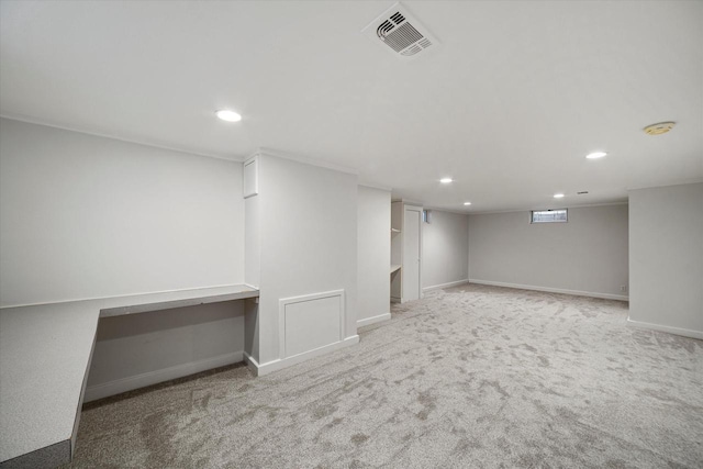 below grade area featuring recessed lighting, visible vents, carpet floors, and baseboards