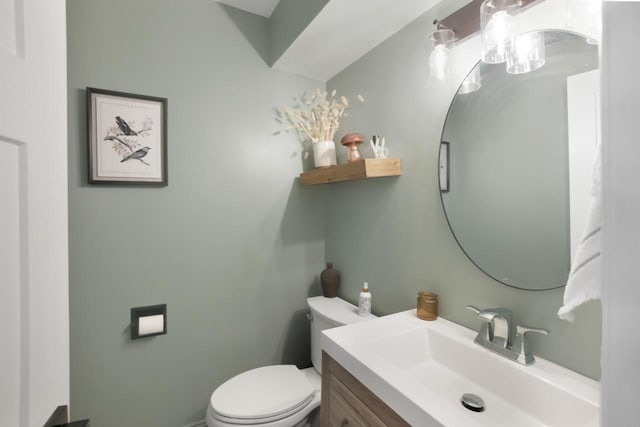 bathroom with toilet and vanity