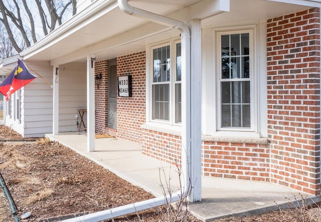 entrance to property with brick siding