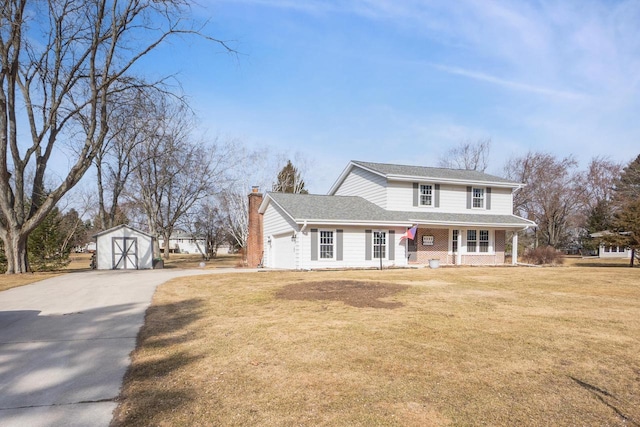 traditional home with a front yard, covered porch, a chimney, an outdoor structure, and a garage