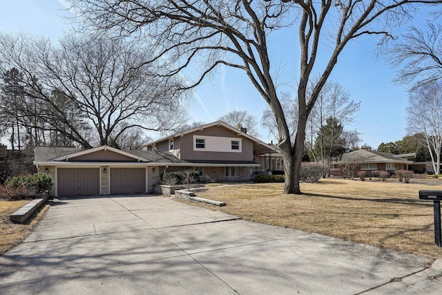 view of front of property with brick siding, a front lawn, a chimney, a garage, and driveway