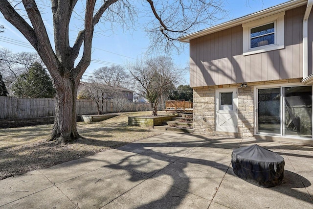 view of patio / terrace featuring fence