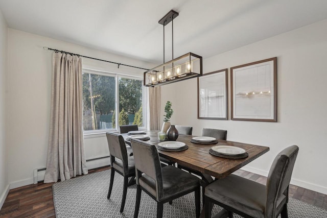 dining space with baseboards, dark wood-style flooring, and baseboard heating