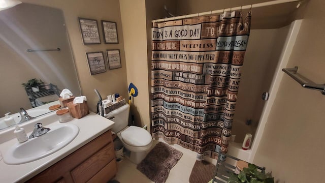 bathroom featuring toilet, shower / tub combo with curtain, and vanity