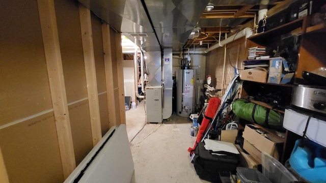 unfinished below grade area featuring heating unit and gas water heater