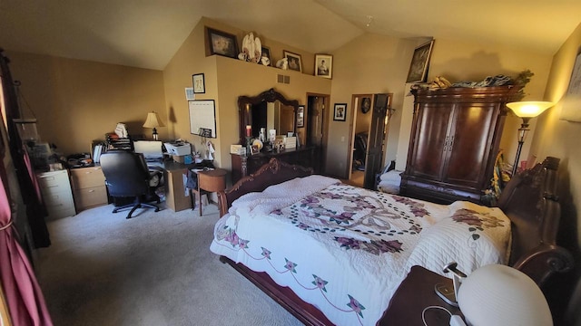 bedroom with lofted ceiling and carpet floors