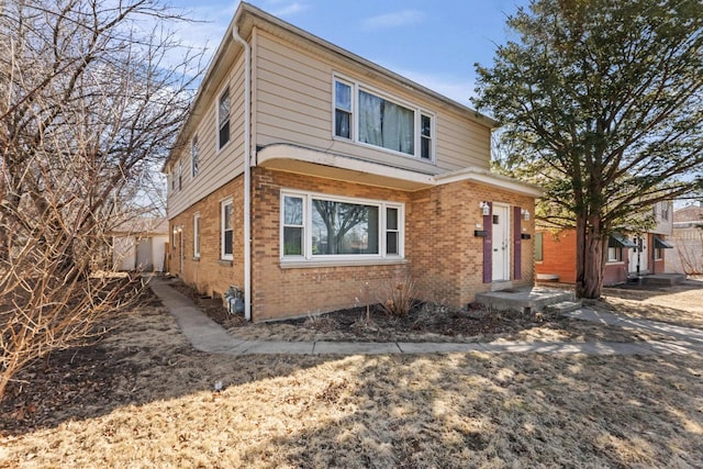 view of front of house featuring brick siding