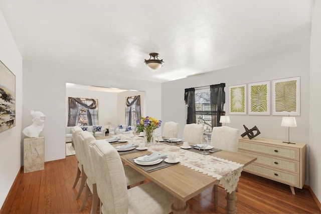 dining space featuring hardwood / wood-style floors