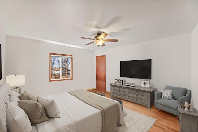 bedroom with light wood finished floors and ceiling fan