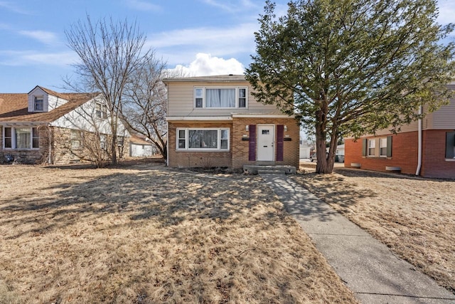 view of front of property featuring brick siding