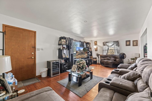 living room featuring wood finished floors and beverage cooler