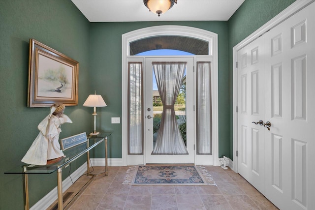 entryway featuring baseboards