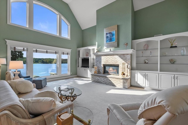 living room featuring carpet flooring, plenty of natural light, a brick fireplace, and high vaulted ceiling