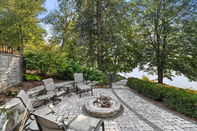 view of patio with a fire pit