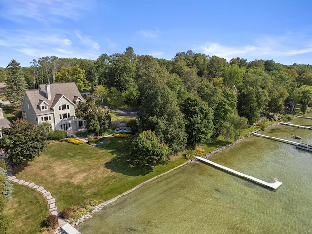 drone / aerial view featuring a view of trees