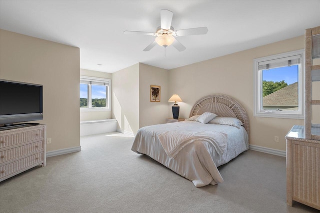 bedroom with baseboards, carpet, and a ceiling fan